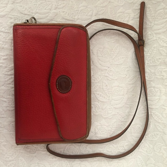 Dooney & Bourke Handbags - Vintage Dooney & Bourke red wallet with leather strap.  Made in the USA.  $75